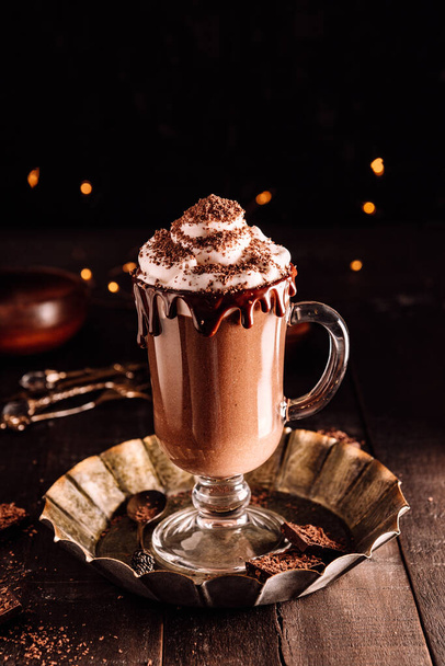  Milkshake with chocolate and whipped cream, dark photo. High quality photo - Fotografie, Obrázek