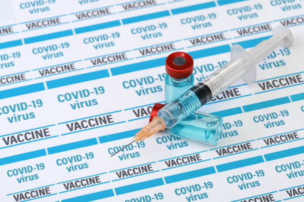 Covid 19 vaccine. Medical ampoules and syringe - 写真・画像