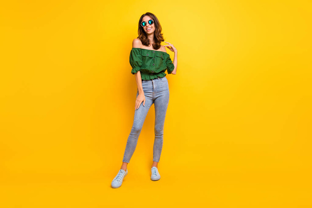 Full size photo of happy cheerful young woman touch shoulder wear off-shoulders blouse isolated on yellow color background - Φωτογραφία, εικόνα