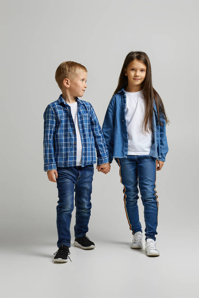 cute little children in stylish denim clothes - Foto, Imagen