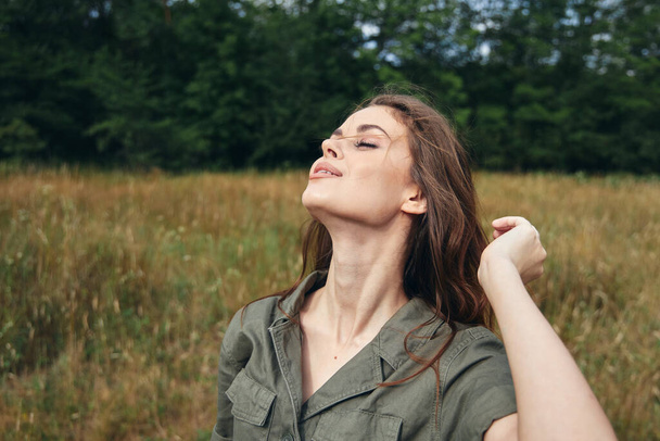 women in nature with loose hair and shirt - Photo, Image