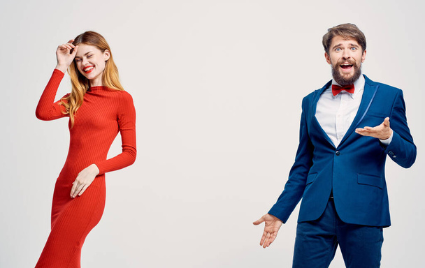 woman in red dress and man in suit elegant style romance communication studio - Photo, Image
