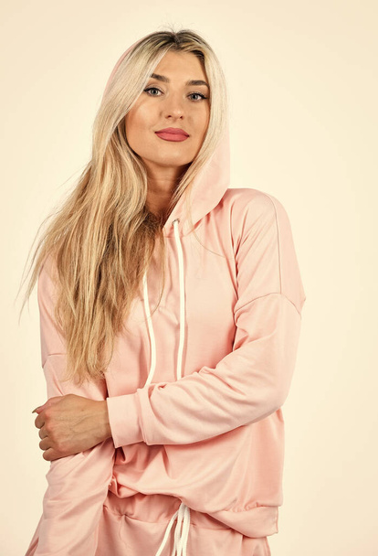 Facial care. sexy fitness girl. sport clothes trend. female sport fashion. sportswear shop. fit woman in pink tracksuit. sporty woman in homewear isolated on white. feeling cozy and comfortable - 写真・画像
