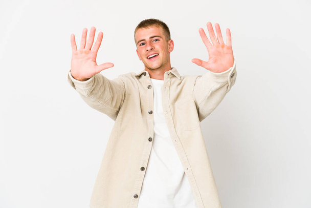 Young caucasian handsome man showing number ten with hands. - Photo, Image