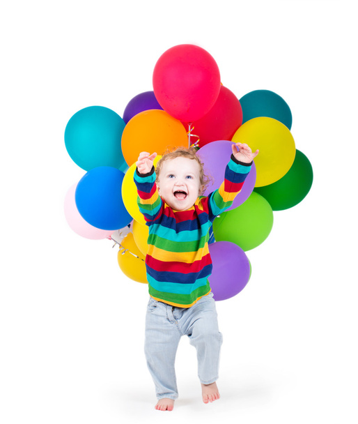 Baby playing with colorful balloons - 写真・画像