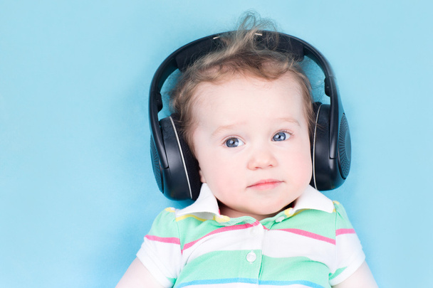 Baby with huge earphones - Photo, image