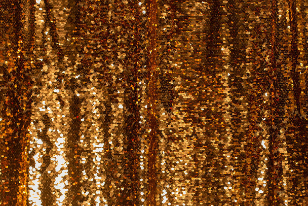 el fondo de oro hecho de lentejuelas, la tendencia de 2021 - Foto, imagen