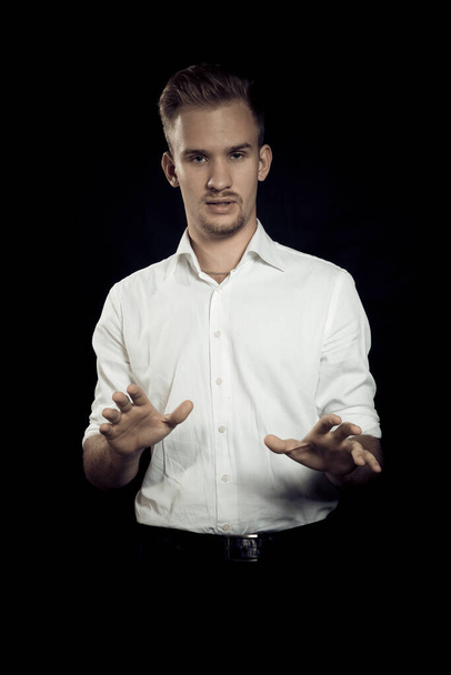 Young man dressed in white shirt studio portrait. - Фото, зображення