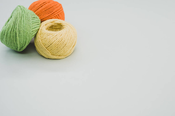 The colorful yarn balls isolated on gray background - Photo, Image