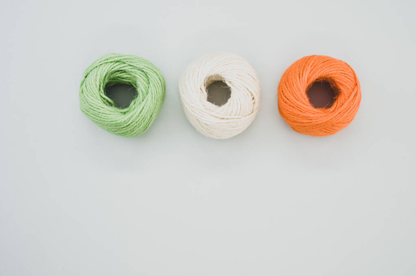 A top view of colorful yarn balls isolated on gray background - Foto, immagini