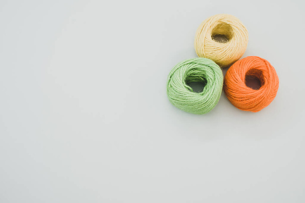 The colorful yarn balls isolated on gray background - Photo, image