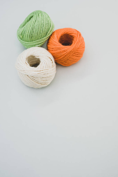 The colorful yarn balls isolated on gray background - Φωτογραφία, εικόνα