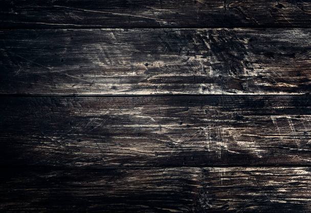 Black wood scratched desk board texture. Abstract background, empty template, text space. - Foto, Imagen