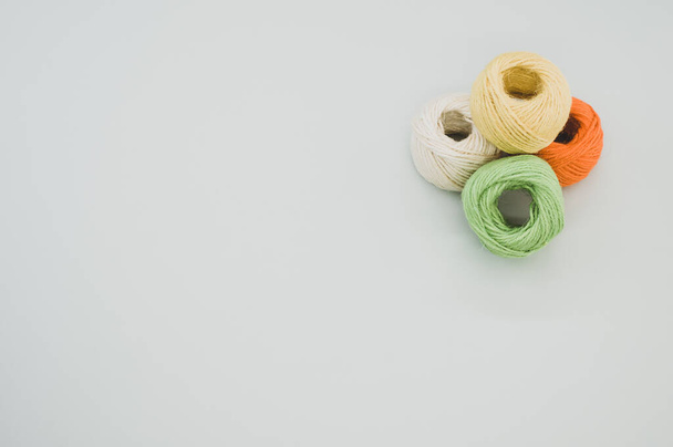 The colorful yarn balls isolated on gray background - Fotoğraf, Görsel