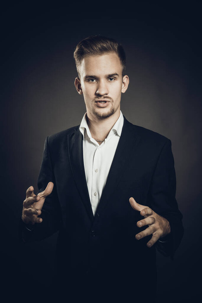Young man dressed in suit studio portrait - Фото, изображение