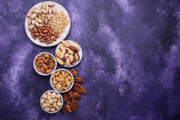 Almonds, pecan, macadamia, pistachio, and cashew - Photo, Image