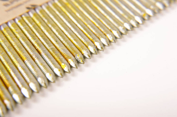 Close up of pack of industrial construction nails for constructions isolated on the white background - Photo, Image