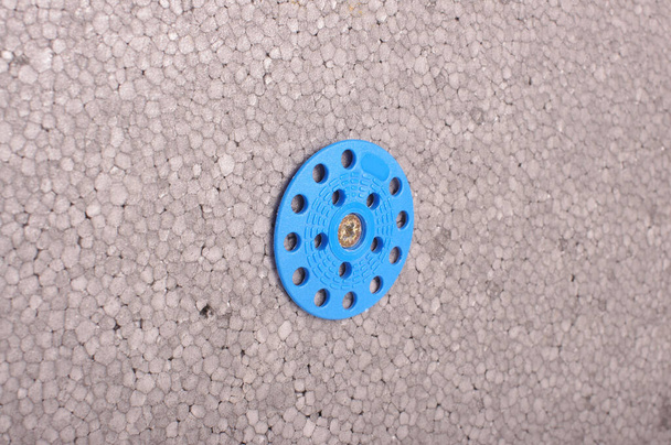 Blue plastic grip washer for thermal insulation fixing for house construction - Photo, Image