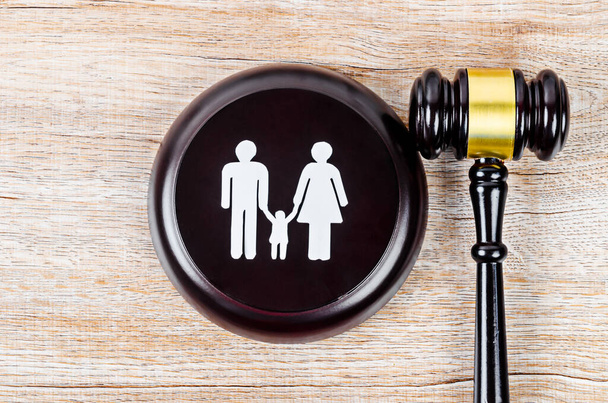 Family figure and gavel on table. Family law concept - Photo, image
