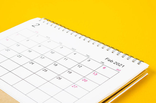 Close up February 2021 Calendar desk for organizer to plan and reminder on yellow background. - Foto, Bild