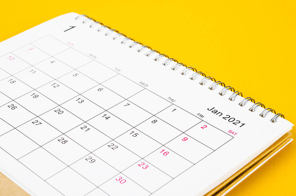 Close up January 2021 Calendar desk for organizer to plan and reminder on yellow background. - Photo, image