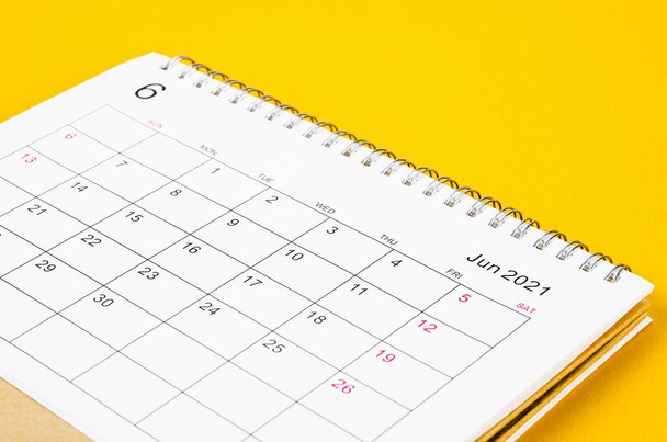 Close up June 2021 Calendar desk for organizer to plan and reminder on yellow background. - Foto, imagen