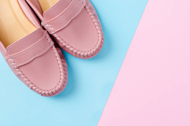 Stylish female shoes in pastel colors on beautiful background. - Фото, изображение