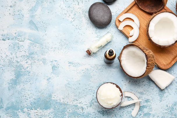Coconut oil and cosmetics on color background - Photo, Image