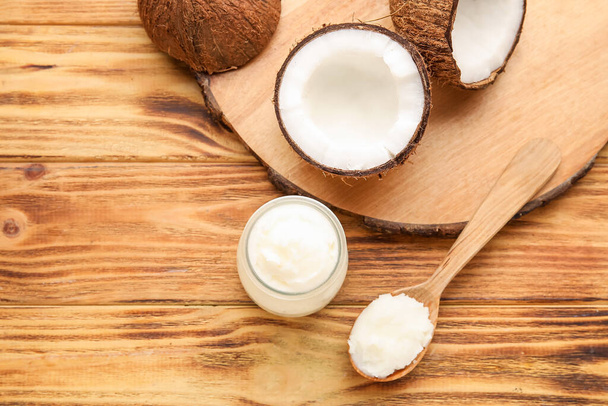 Composition with coconut oil on wooden background - Photo, Image