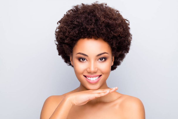 Close up photo of charming afro american girl enjoy pampering tone concealer skincare treatment make skin soft pure shiny soft fresh perfect ideal touch palm chin isolated grey color background - Φωτογραφία, εικόνα