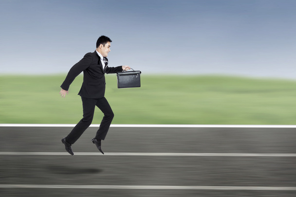 Businessman Running On A Racing Track - Photo, Image