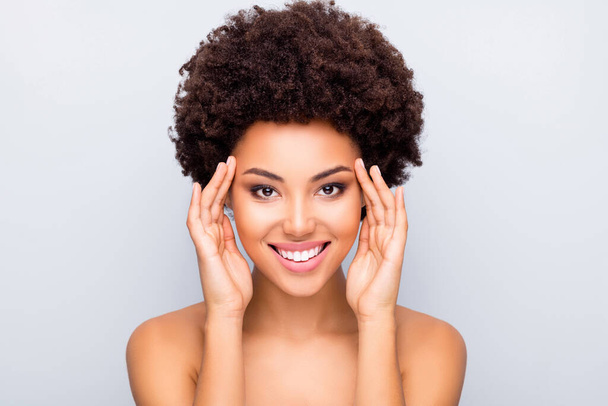 Close up photo of charming afro american girl touch her eyes enjoy skincare cosmetology correction make-up tone skin flawless pure fresh isolated over grey color background - Fotografie, Obrázek