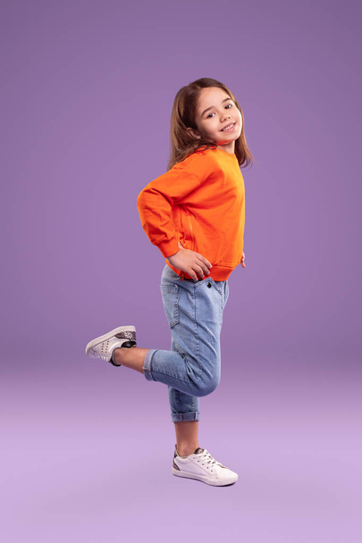 Playful little girl in trendy casual wear - Foto, Imagen