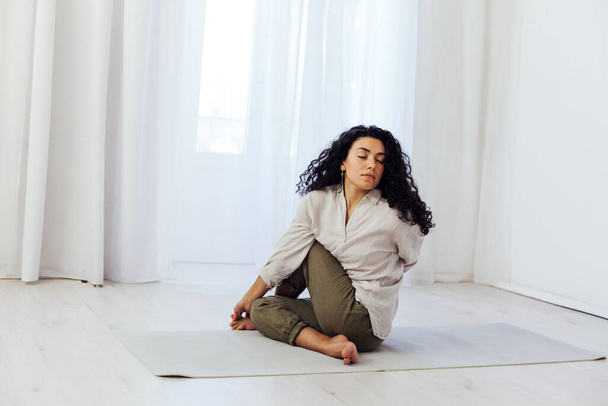 Beautiful woman yoga asana gymnastics body flexibility - Fotoğraf, Görsel