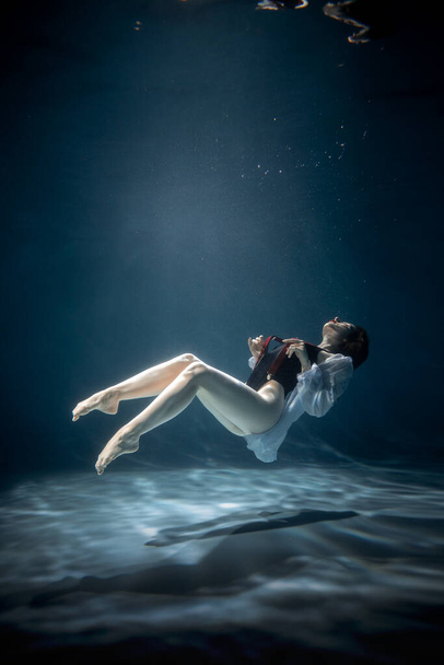 Portrait of an Attractive Young Woman Underwater. Beauty and Fashion - Fotó, kép
