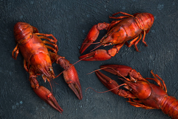 Crayfish. Red boiled crawfishes on table in rustic style, closeup.  - Foto, Imagem