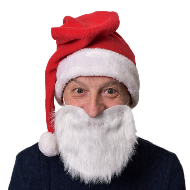 man in santa hat and fake beard on white background - Foto, Bild