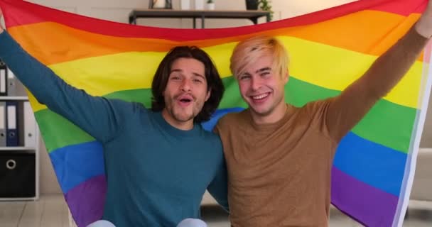 Two gay men holding lgbt flag - Footage, Video