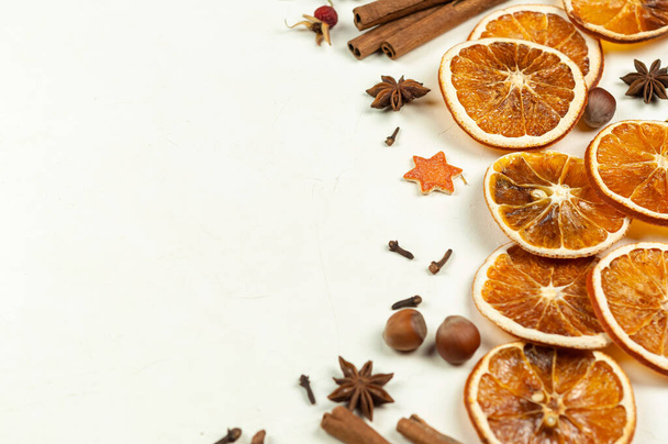 Dry orange slices, cinnamon sticks,anise on a dark background with space for text.Christmas background - Fotó, kép
