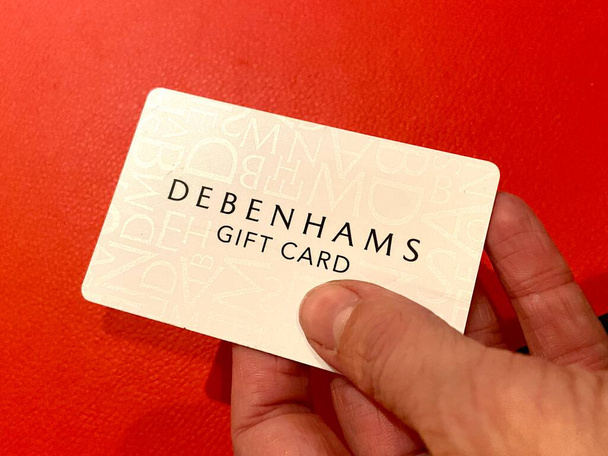 Debenhams Topshop , London, UK - 02. Dec 2020: Gift cards - Debenhams Topshop both part of the Arcadia Group own by Sir Philip Green on the verge of financial collapse due to covid-19 people rush to redeem gift card - Photo, Image