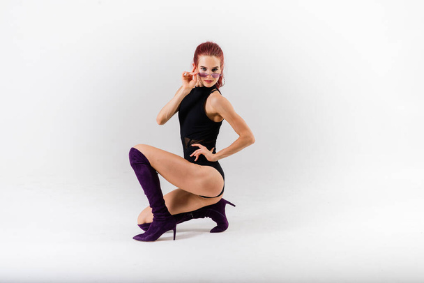 Sexy pole redhead dancer showing her body - Фото, изображение
