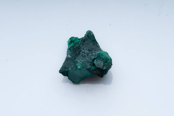 Malachite green ore on a white background. Natural green malachite - Photo, Image