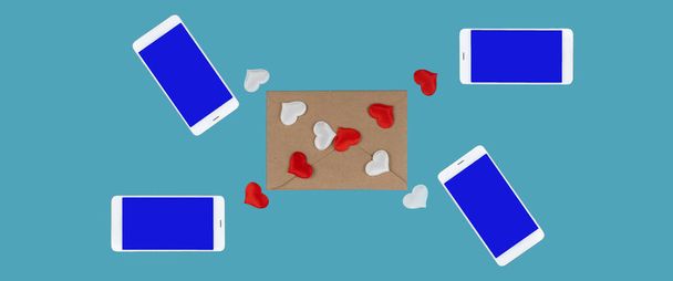 Mobieltjes en hartjes op een blauwe achtergrond. berichten doorsturen voor Valentijnsdag. Een romantisch gesprek. virtuele liefde. spandoek - Foto, afbeelding