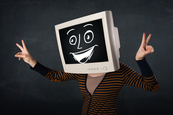 Girl with a monitor head and a cheerful cartoon face - Fotoğraf, Görsel