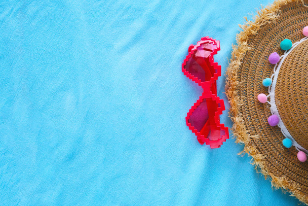 Banner on a blue background red glasses in the form of a heart and a hat.  - Fotó, kép