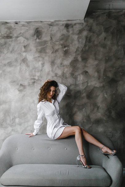 Beautiful curly girl posing in white shirt - Zdjęcie, obraz