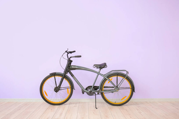 Modern bicycle against color wall - Photo, Image