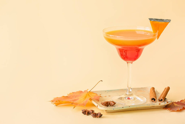 Glass of tasty pumpkin pie martini on light background - Photo, Image