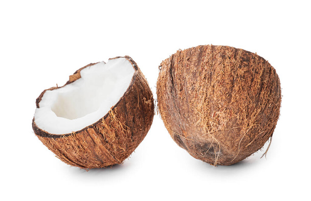 Halves of ripe coconut on white background - Photo, Image