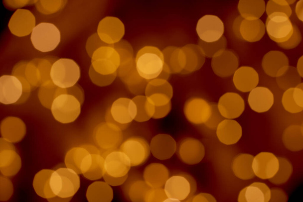 Beautiful defocused golden lights bokeh abstract background - Photo, Image